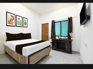 Postel nebo postele na pokoji v ubytování Hotel Shivay Deluxe + 17 fotografií