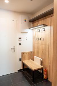a kitchen with a wooden table in a room at Apartmán Maruška in Dolní Morava