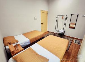 Ένα ή περισσότερα κρεβάτια σε δωμάτιο στο Crystal Beach Inn Terengganu