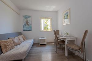 a living room with a couch and a table at Villa Vera in Hvar
