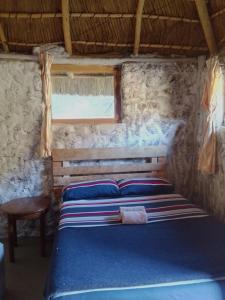 Ένα ή περισσότερα κρεβάτια σε δωμάτιο στο Ha Ramabanta Riverside