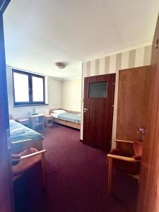 Posteľ alebo postele v izbe v ubytovaní Hotel Paola