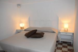 Postel nebo postele na pokoji v ubytování GuesTrulli