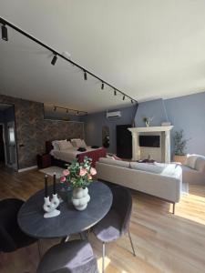 a living room with a couch and a table at Hartje Centrum in Zwolle