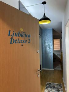 a door with the words lucida deluce on it at Ljubičica deluxe 2 - Novo - Privatno dvorište - Parking in Vrnjačka Banja +25 photos