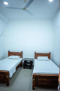 Postel nebo postele na pokoji v ubytování Backpackers GuestHouse Trincomalee