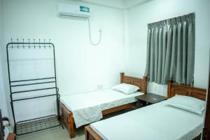 Postel nebo postele na pokoji v ubytování Backpackers GuestHouse Trincomalee