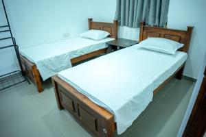 Postel nebo postele na pokoji v ubytování Backpackers GuestHouse Trincomalee