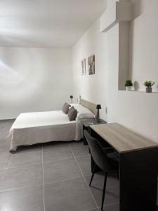 Ένα ή περισσότερα κρεβάτια σε δωμάτιο στο B&B centro baia domizia