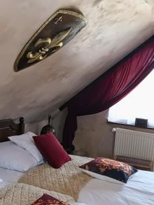 a bedroom with two beds and a surfboard on the ceiling at Hraško in Rimavská Sobota