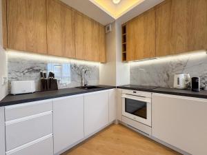 Η κουζίνα ή μικρή κουζίνα στο Apartamenty Na Klifie Q4 Apartments