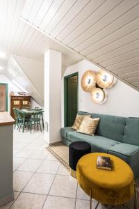 a living room with a couch and a table at Hanga vendégház in Villány