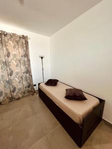 a bedroom with a bed in a room at Il Glicine Casa Vacanze in Augusta +18 photos