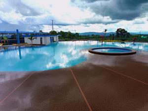 a large empty swimming pool with blue water at Gaia512A in Montenegro