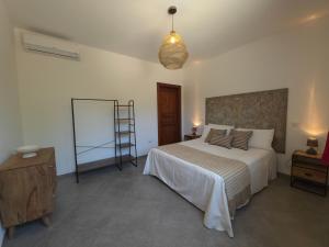 Postel nebo postele na pokoji v ubytování Villa Denu Salento - Intera Dimora con Piscina ad uso esclusivo