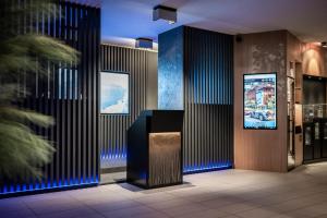 TV a/nebo společenská místnost v ubytování Smart Hotel Saslong
