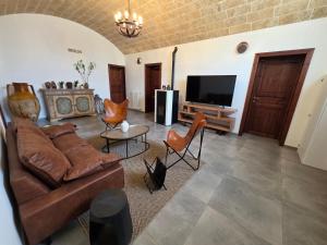 TV a/nebo společenská místnost v ubytování Villa Denu Salento - Intera Dimora con Piscina ad uso esclusivo