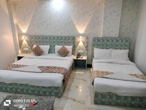 Postel nebo postele na pokoji v ubytování Hotel Hayat Inn
