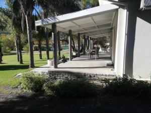 a porch with a white awning on a house at Altenburgh Accommodation - Apartments in Somerset East