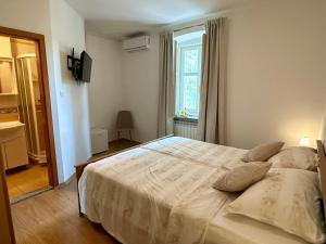Postel nebo postele na pokoji v ubytování Villa Milada