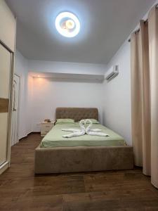 Ένα ή περισσότερα κρεβάτια σε δωμάτιο στο Vila LALA