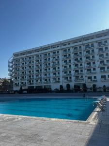 a large building with a swimming pool in front of it at Angelina Art in Trnava