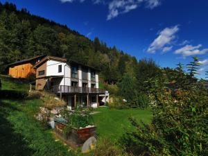 a house on a hill with a yard at Sunny Villa in Bad Kleinkirchheim