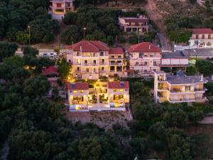 an aerial view of a large house with lights at Elaia Modern Apartments in Agía Kyriakí