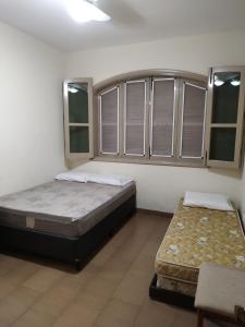 Postel nebo postele na pokoji v ubytování L'Harmonie 5 suítes, salão jogos, piscina, churrasqueira, amplo terraço + 151 fotografií