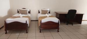 Postel nebo postele na pokoji v ubytování NEW LODGE - Westdene