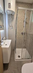 a bathroom with a shower and a sink at Green bay apartment in Korčula +28 photos