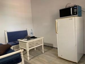 Kuchyň nebo kuchyňský kout v ubytování Bungalow avec piscine