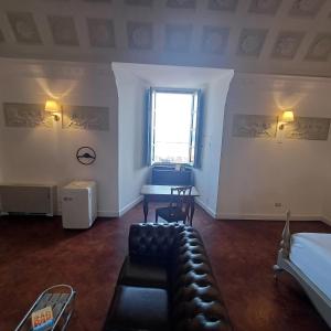 Postel nebo postele na pokoji v ubytování Palazzo Boyl 1840