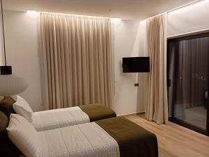 Postel nebo postele na pokoji v ubytování Afea Villas + 37 fotografií