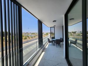 a view from the balcony of a building with glass windows at Infinity Luxury Mansions in Yeri