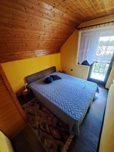 Postel nebo postele na pokoji v ubytování Vikendica Kod Čake,Subotica