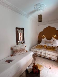 Postel nebo postele na pokoji v ubytování Riad Jardin de Malia