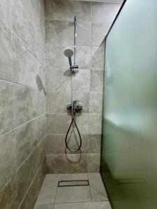 a shower with a glass door in a bathroom at Apartment Summer Vibes in Sveti Vlas