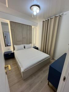 En eller flere senge i et værelse på Bing apartment