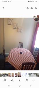 a picture of a bedroom with a bed and two chairs at Adorable Villa in Hull +3 photos