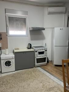 O bucătărie sau chicinetă la Capital Studio