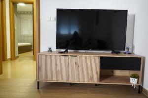 TV a/nebo společenská místnost v ubytování Urbanest