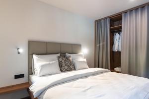 Postel nebo postele na pokoji v ubytování Gora Luxury Apartments