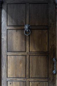 a wooden door with a knob on it at Hotel Experior Boutique - Destigo Hotels in Krakow +42 photos