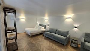 Postel nebo postele na pokoji v ubytování La mezzanine by Vindihouses
