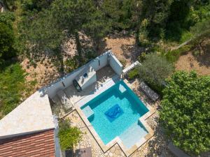 an overhead view of a swimming pool next to a house at Kuca Orhidea in Crikvenica