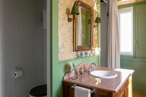 a bathroom with a sink and a mirror at Rosegarden Essence Sintra - by Unlock Hotels in Sintra +33 photos