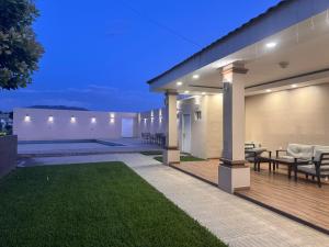 a backyard of a home at night with a patio at Anturios House Apartamento 2 in San Marcos