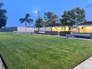 a park with benches and a grass field at Anturios House Apartamento 2 in San Marcos +5 photos