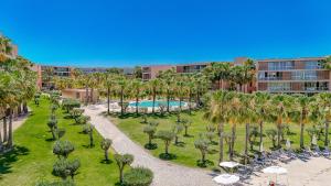 an overhead view of a park with palm trees and a pool at Entre o Vale e o Mar - Herdade dos Salgados in Guia